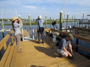 Tuesday, 8:22 a.m. The count gets underway, checking minnow traps and scoping birds along the inlet off the dock across from Bob’s beach house.